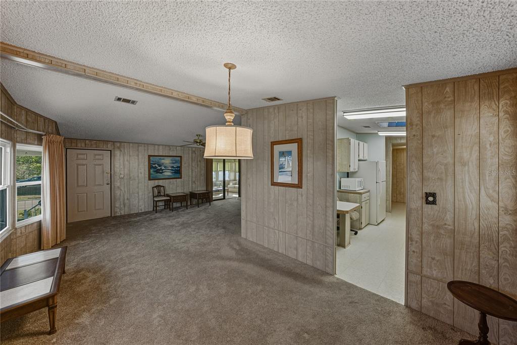 14921 Rialto Avenue Brooksville, FL 34613 - Photo 18 of 55 a view of a room with entryway windows and cabinet