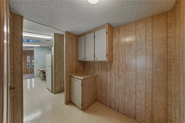 a bathroom with a shower and a sink