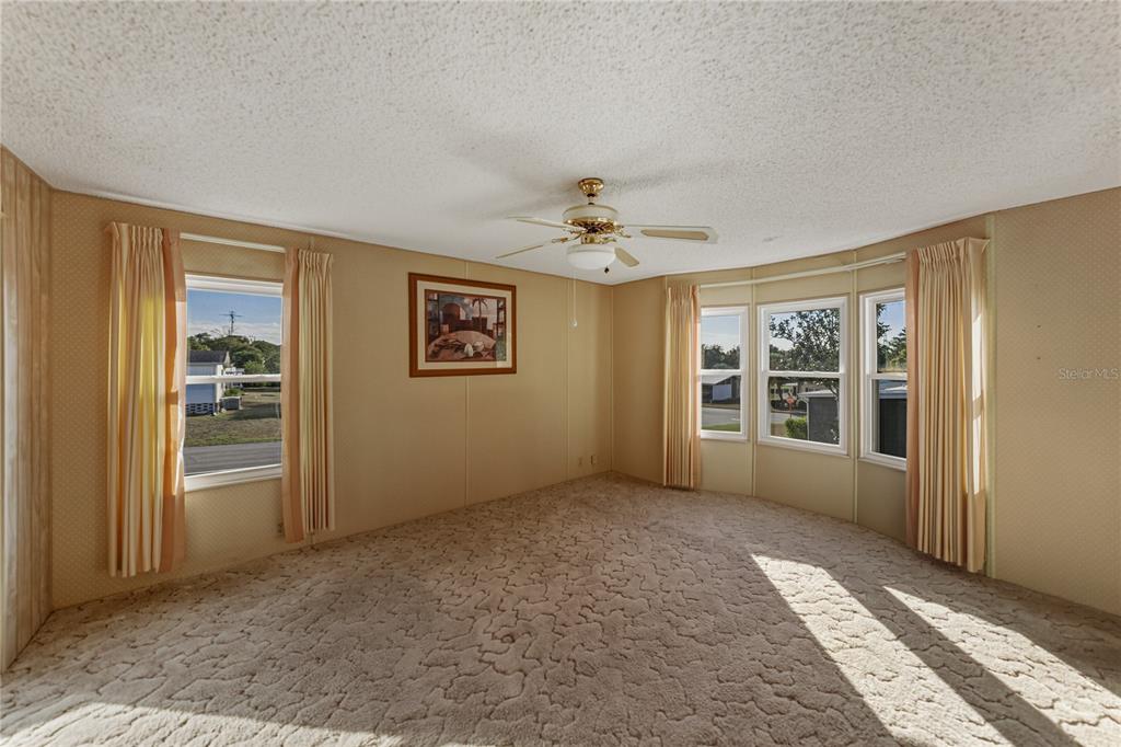 14921 Rialto Avenue Brooksville, FL 34613 - Photo 27 of 55 an empty room with windows
