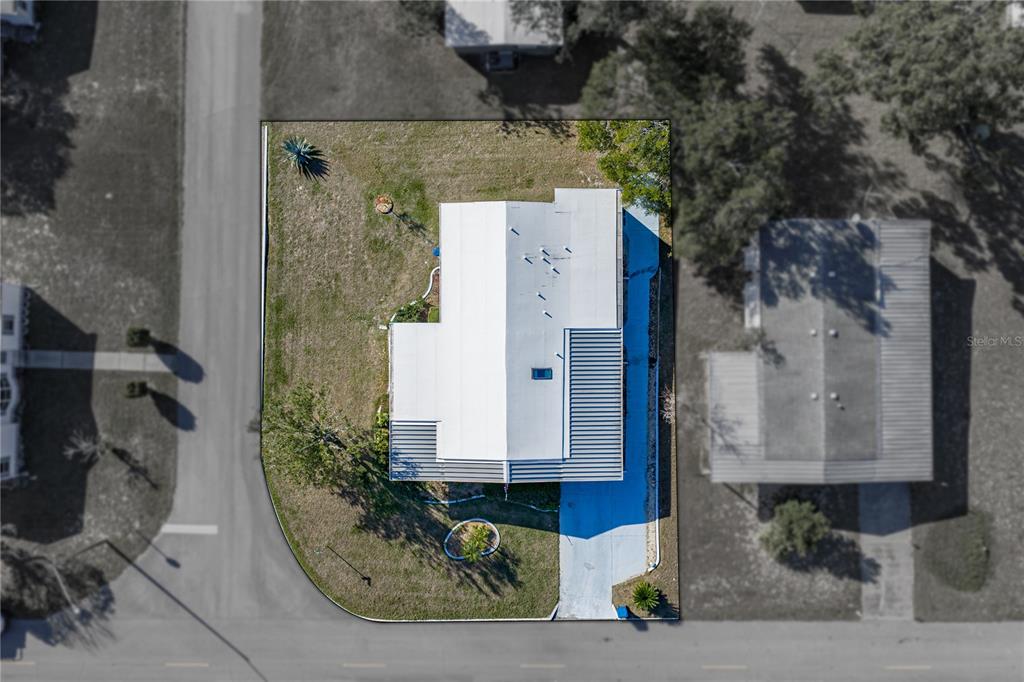 14921 Rialto Avenue Brooksville, FL 34613 - Photo 3 of 55 an aerial view of a house with a yard