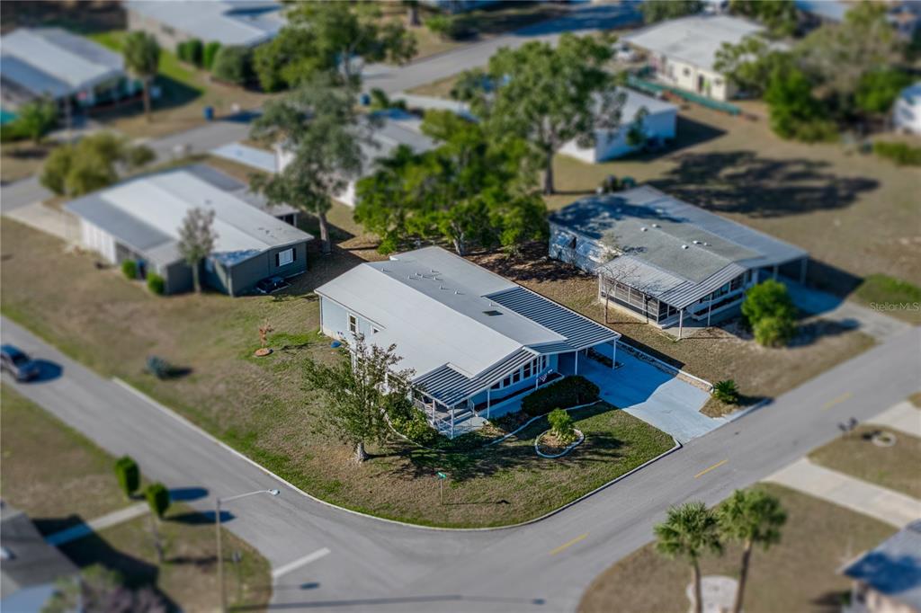 14921 Rialto Avenue Brooksville, FL 34613 - Photo 4 of 55 an aerial view of a house with garden