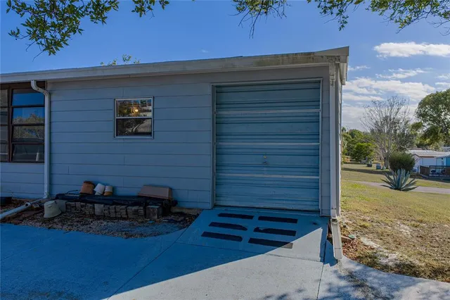 an aerial view of house with yard