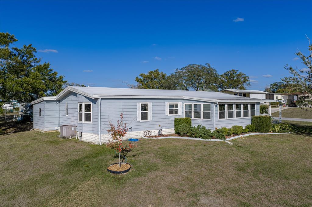 14921 Rialto Avenue Brooksville, FL 34613 - Photo 43 of 55 a view of house with outdoor space and sitting area