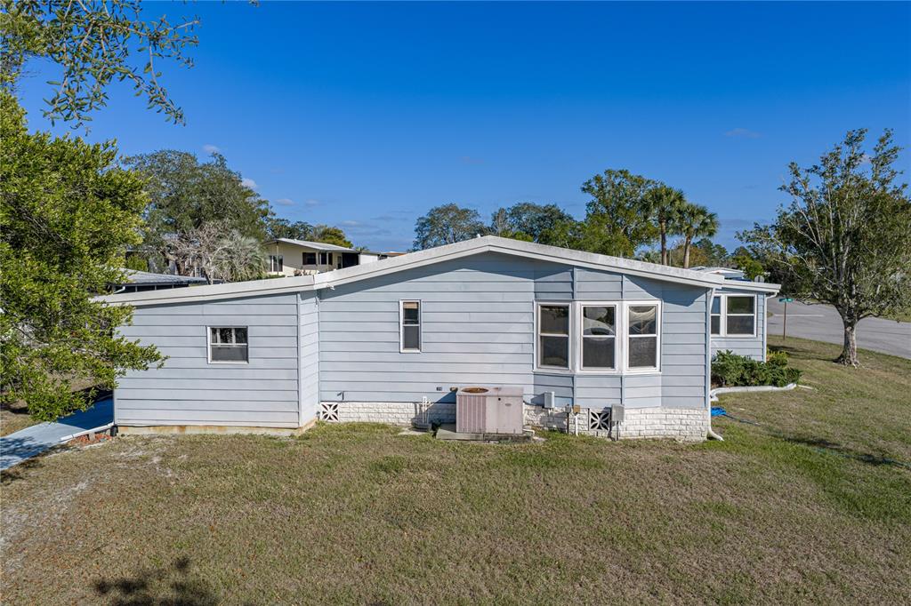 14921 Rialto Avenue Brooksville, FL 34613 - Photo 44 of 55 a view of a house with a yard
