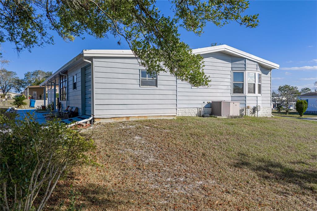 14921 Rialto Avenue Brooksville, FL 34613 - Photo 45 of 55 a view of a house with a yard