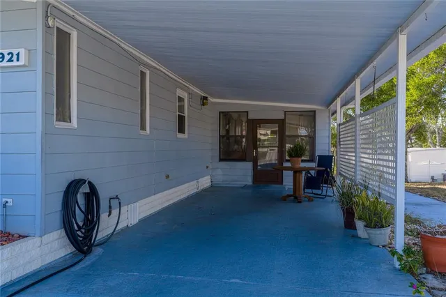 a view of livingroom with furniture and floor to ceiling window