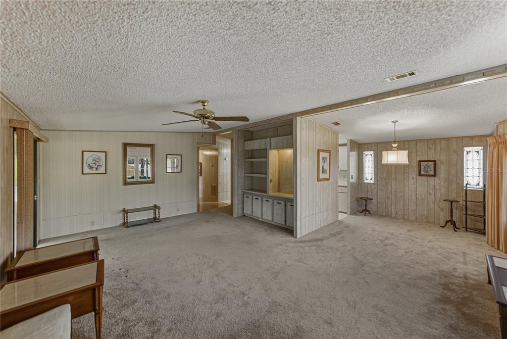 14921 Rialto Avenue Brooksville, FL 34613 - Photo 8 of 55 an empty room with closet and mirrors