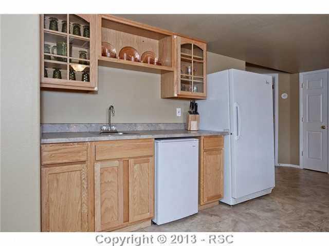 12009 Rio Secco Road Peyton, CO 80831 - Photo 18 of 24 Wet Bar in Baement - refrigerators are excluded.