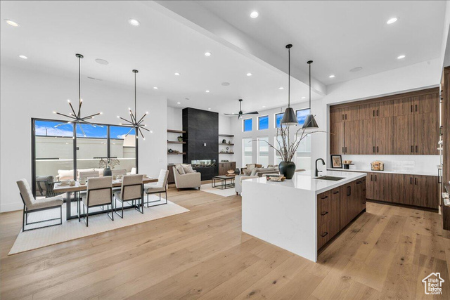 2761 West Lava Hls Road Santa Clara, UT 84765 - Photo 53 of 53 Kitchen with open floor plan, a chandelier, ceiling fan, light stone counters, and light wood-style flooring