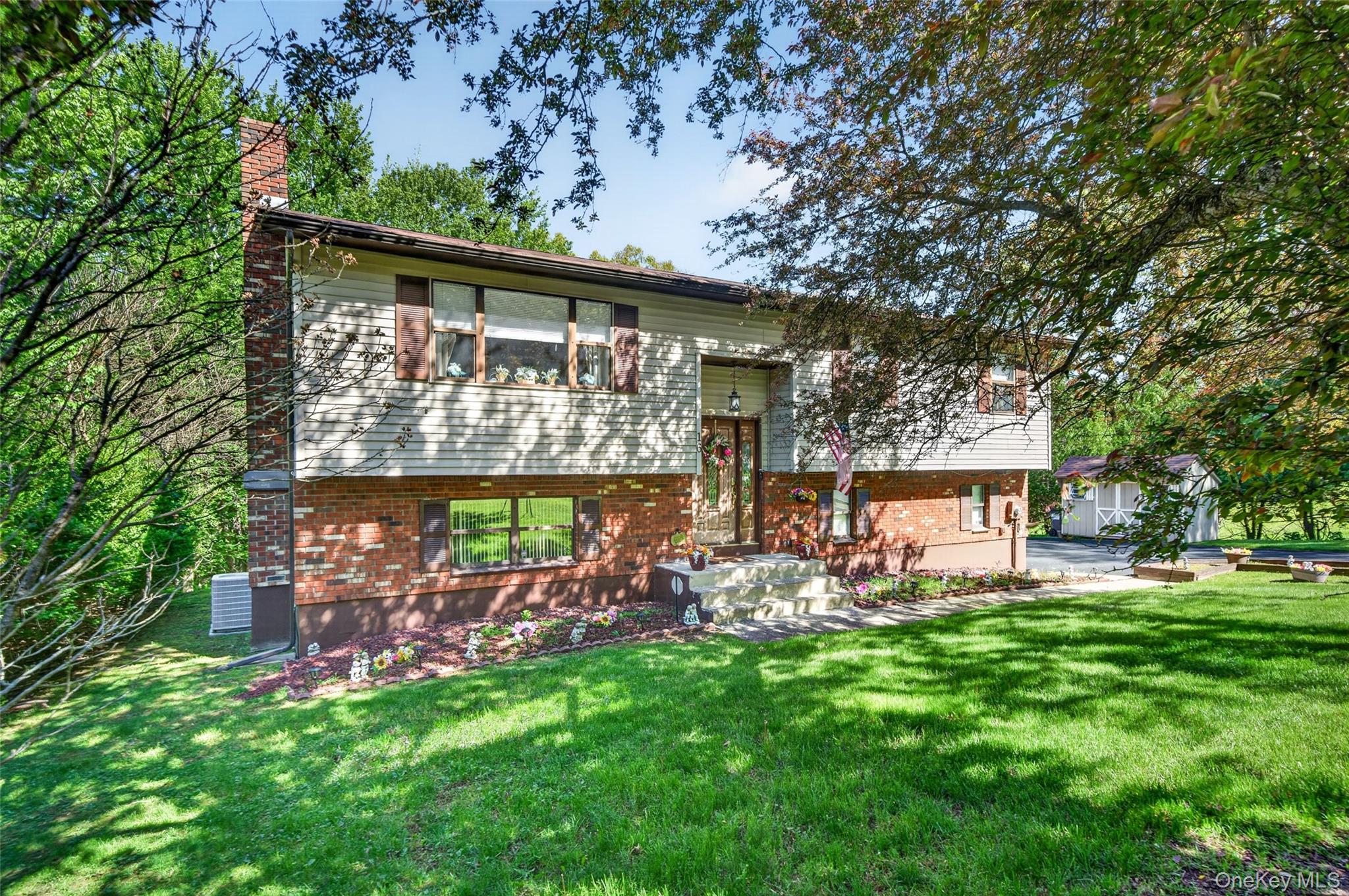 16 Woodward Road Slate Hill, NY 10973 - Photo 1 of 37 front view of a house with a garden