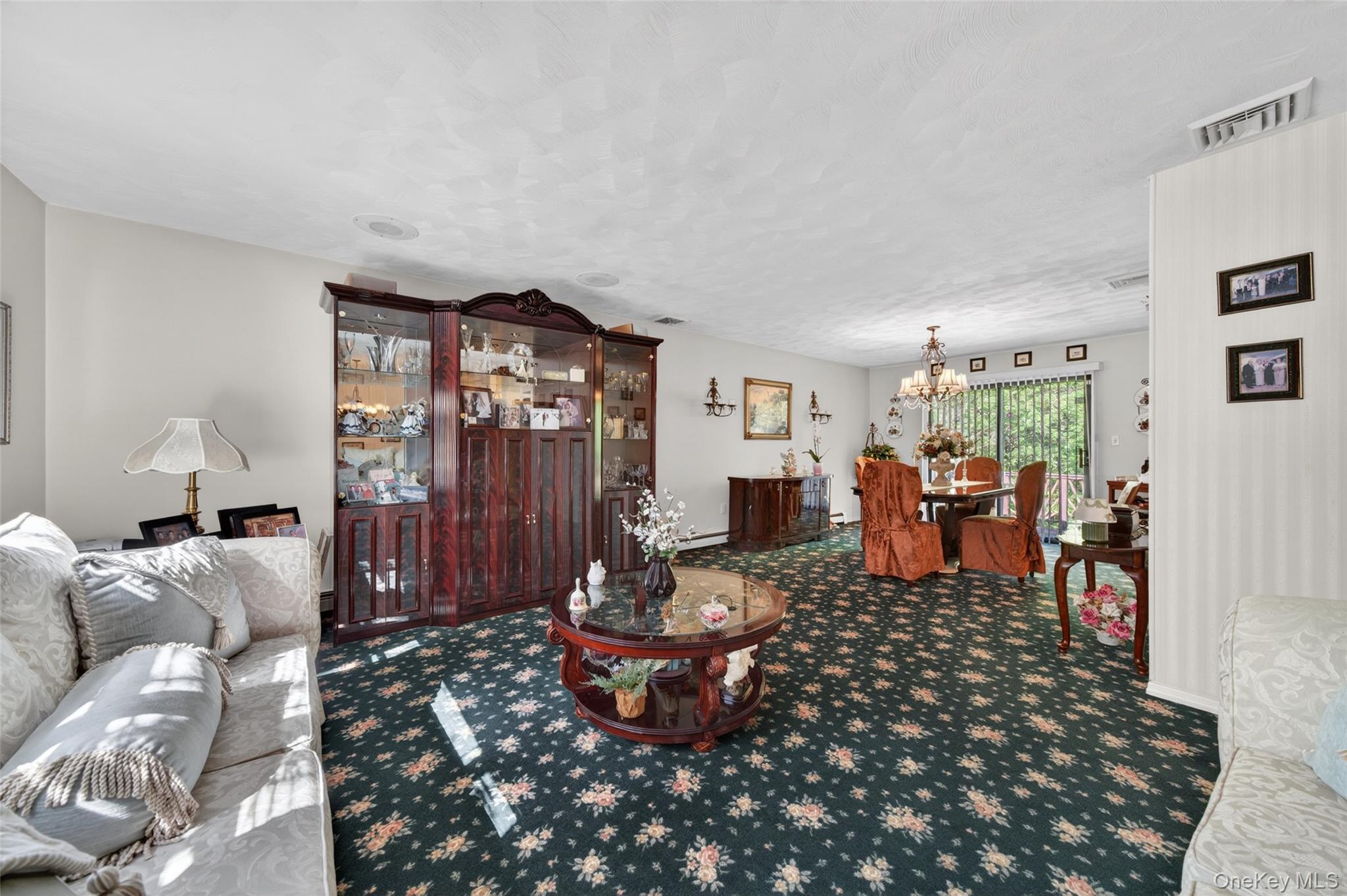 16 Woodward Road Slate Hill, NY 10973 - Photo 13 of 37 a living room with furniture and a chandelier