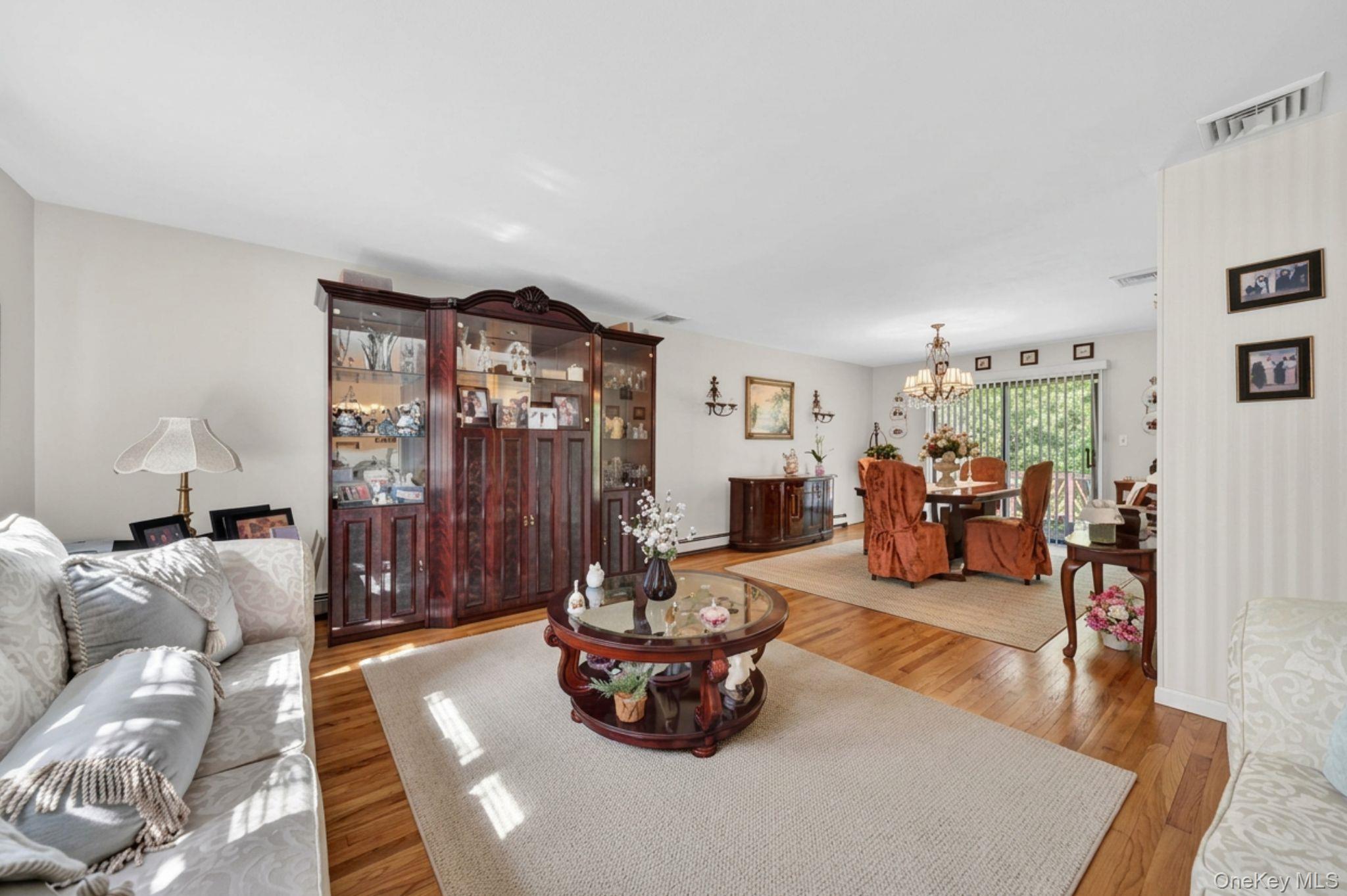 16 Woodward Road Slate Hill, NY 10973 - Photo 14 of 37 a living room with furniture and a chandelier