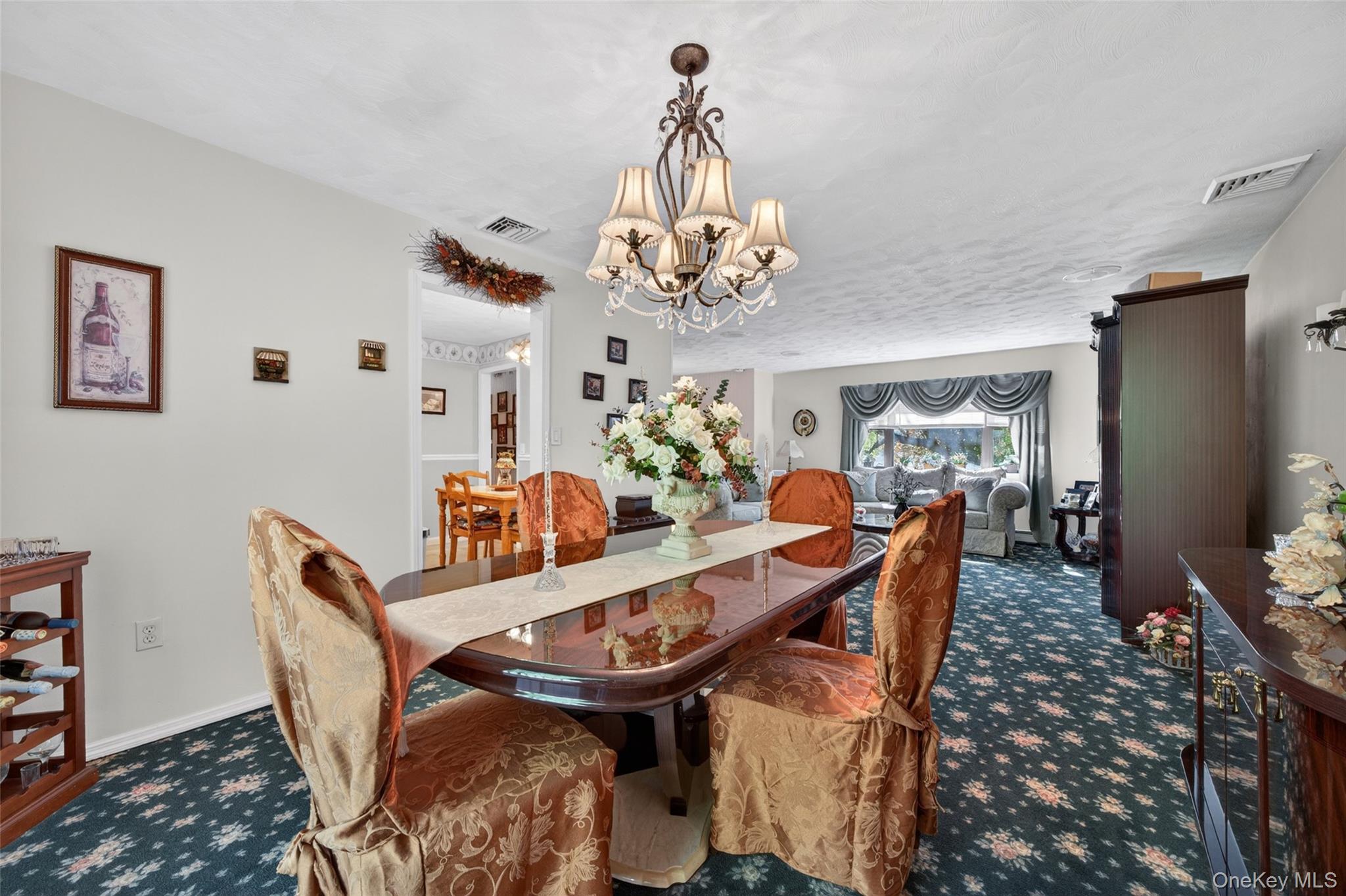 16 Woodward Road Slate Hill, NY 10973 - Photo 19 of 37 a view of a dining room with furniture a chandelier and wooden floor