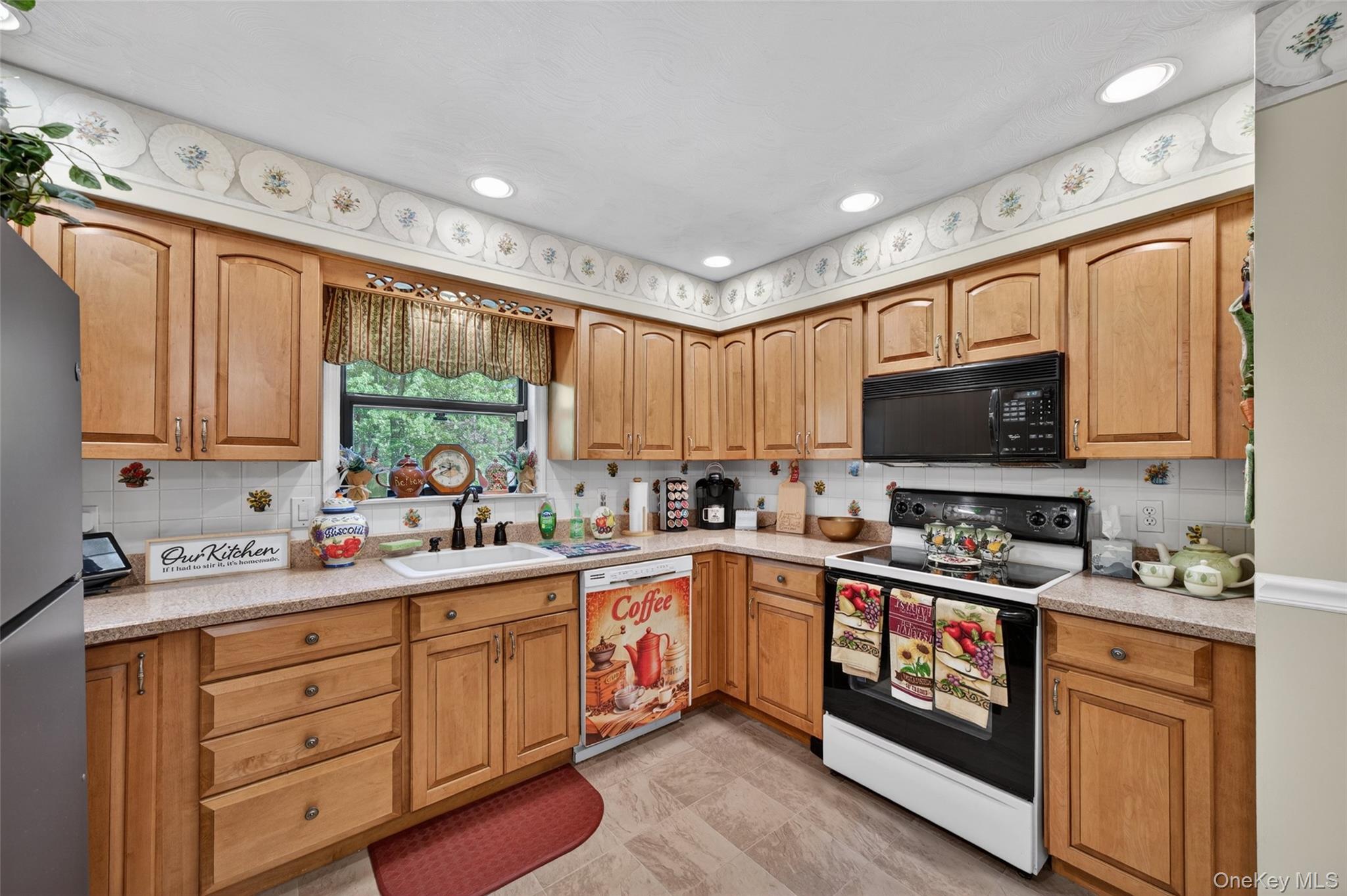 16 Woodward Road Slate Hill, NY 10973 - Photo 21 of 37 a kitchen with kitchen island granite countertop a sink appliances cabinets and a counter top space
