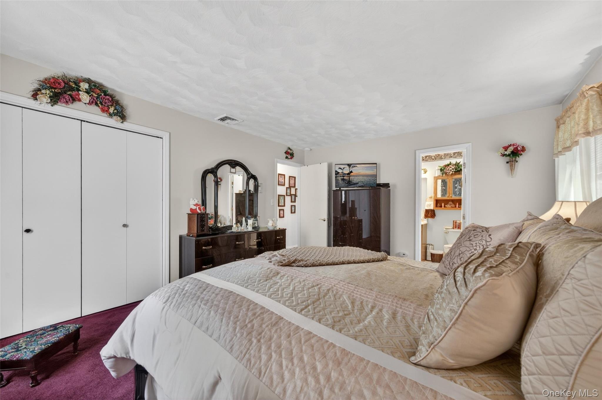 16 Woodward Road Slate Hill, NY 10973 - Photo 26 of 37 a spacious bedroom with a bed and a dresser
