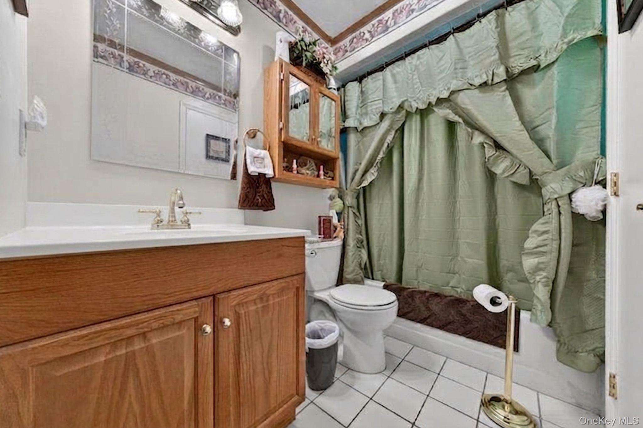 16 Woodward Road Slate Hill, NY 10973 - Photo 31 of 37 a bathroom with a sink toilet a mirror and shower