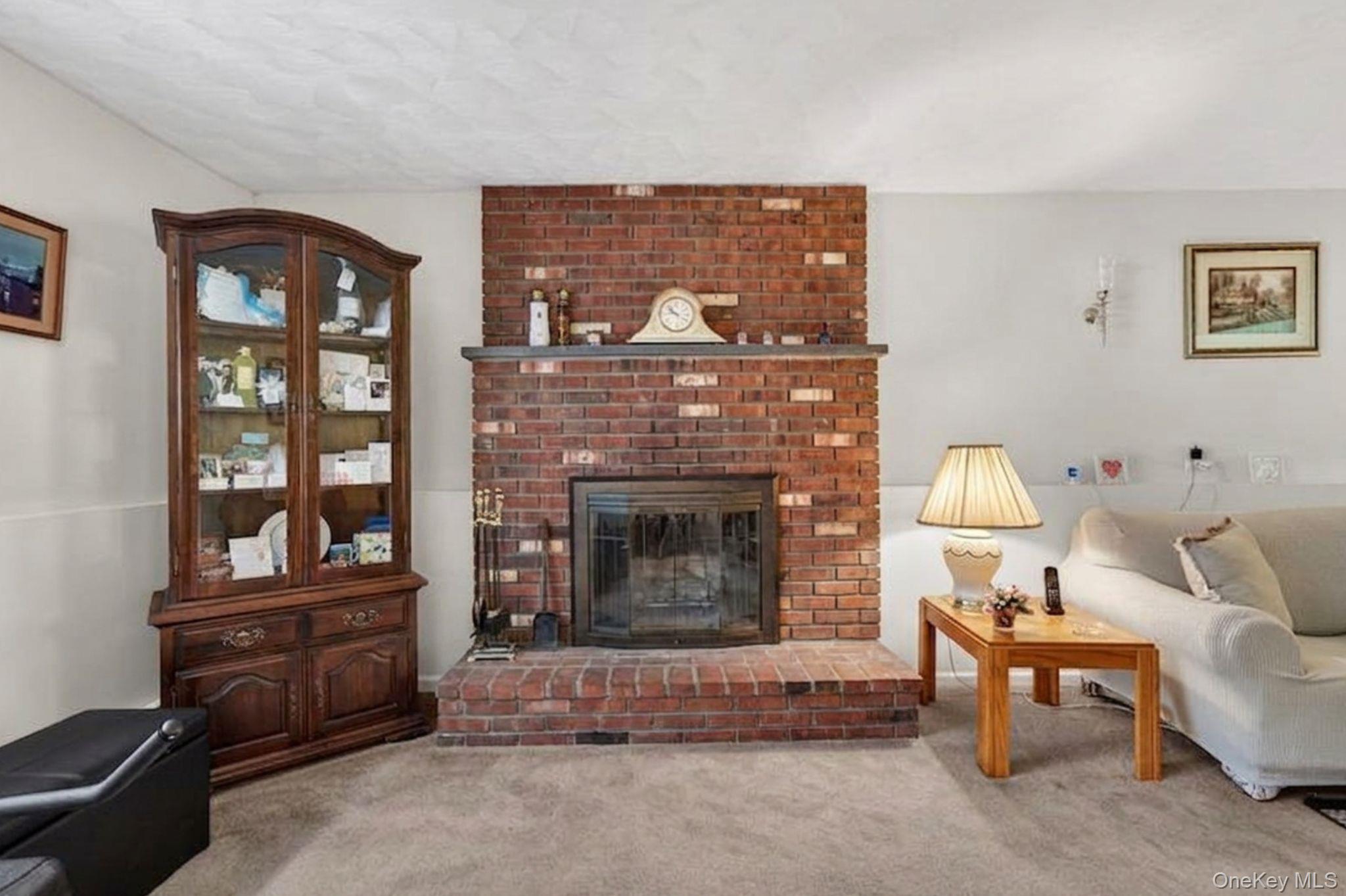 16 Woodward Road Slate Hill, NY 10973 - Photo 33 of 37 a living room with furniture and a fireplace