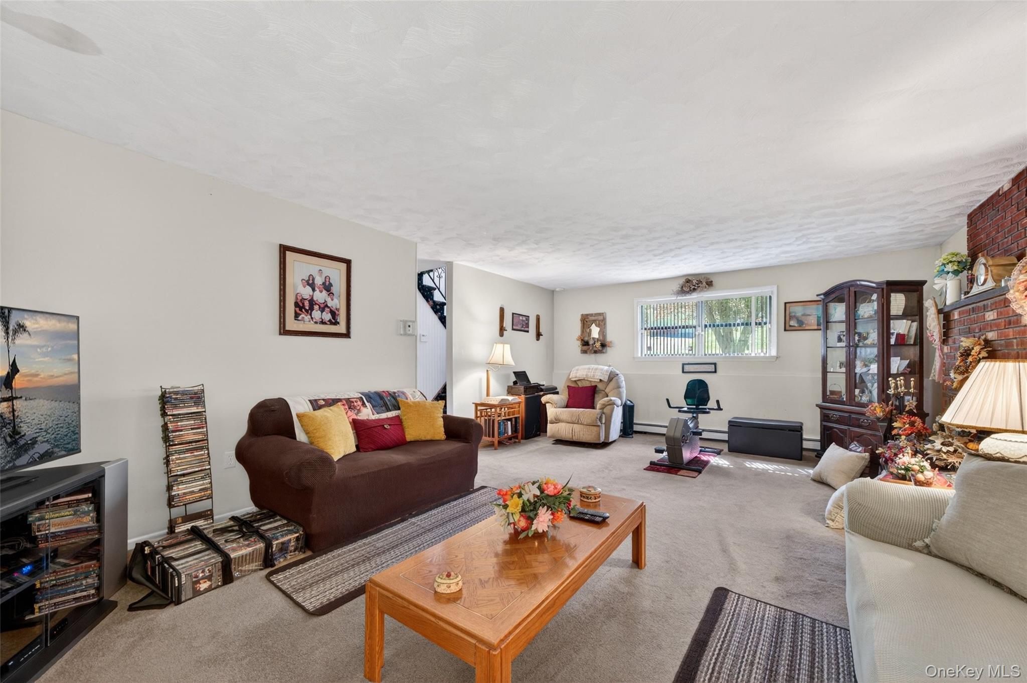 16 Woodward Road Slate Hill, NY 10973 - Photo 34 of 37 a living room with furniture and a flat screen tv