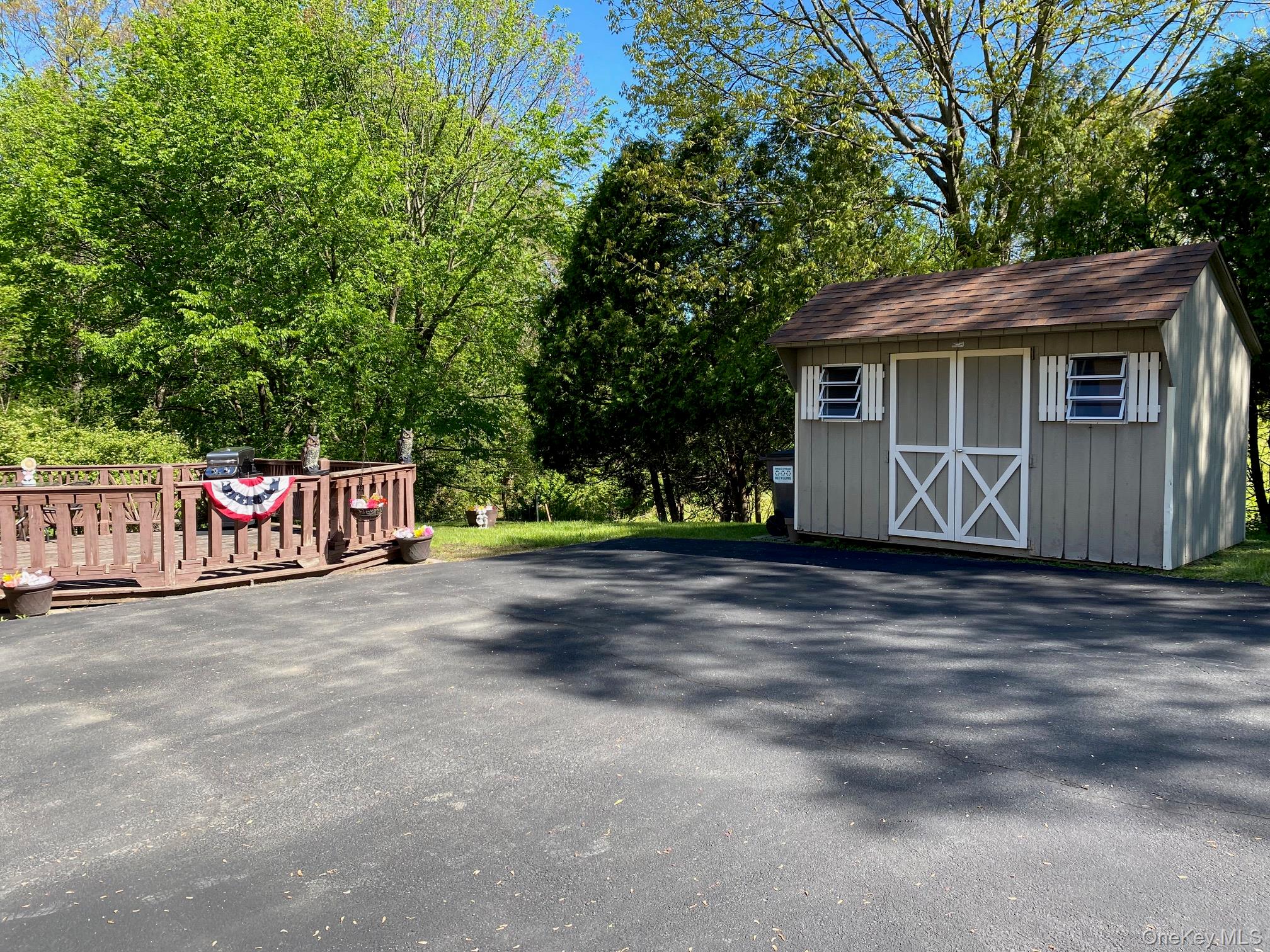16 Woodward Road Slate Hill, NY 10973 - Photo 6 of 37 a view of a house with a yard and garage
