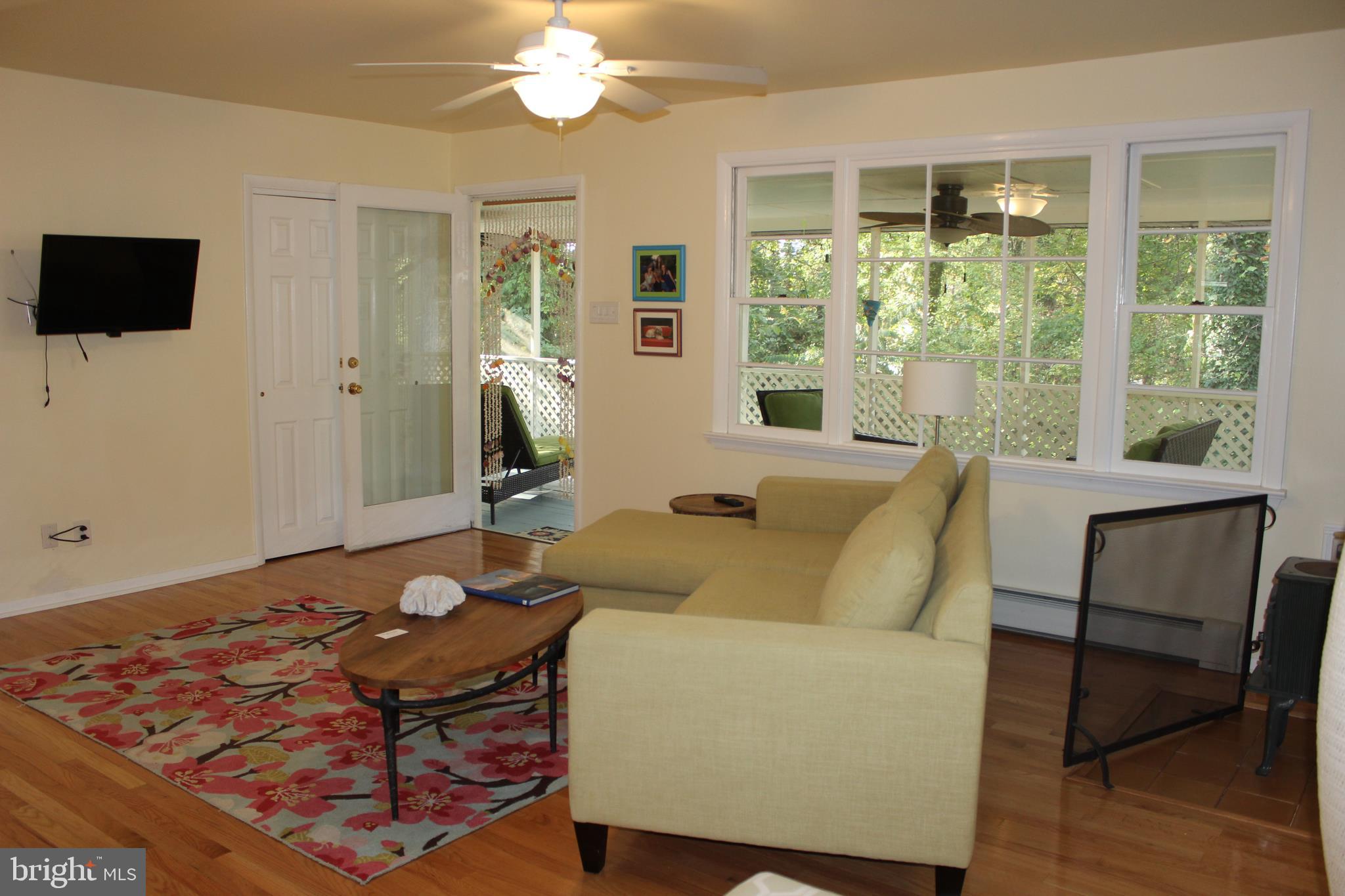 96 Tower Point Road Chesapeake City, MD 21915 - Photo 13 of 30 Side Living Room showing door to screened porch