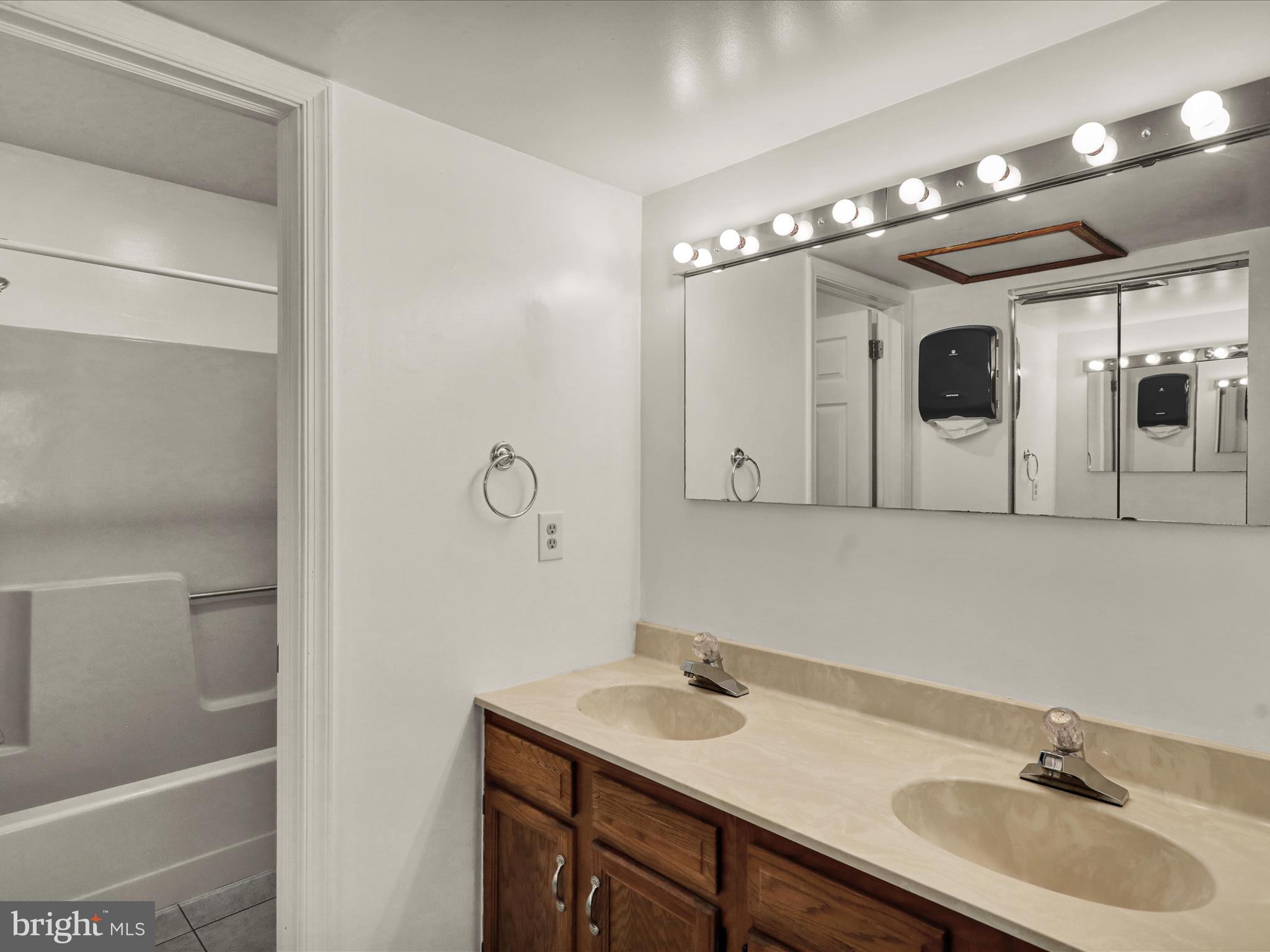 225 North 14th Street Reading, PA 19604 - Photo 13 of 23 a bathroom with a sink and a mirror