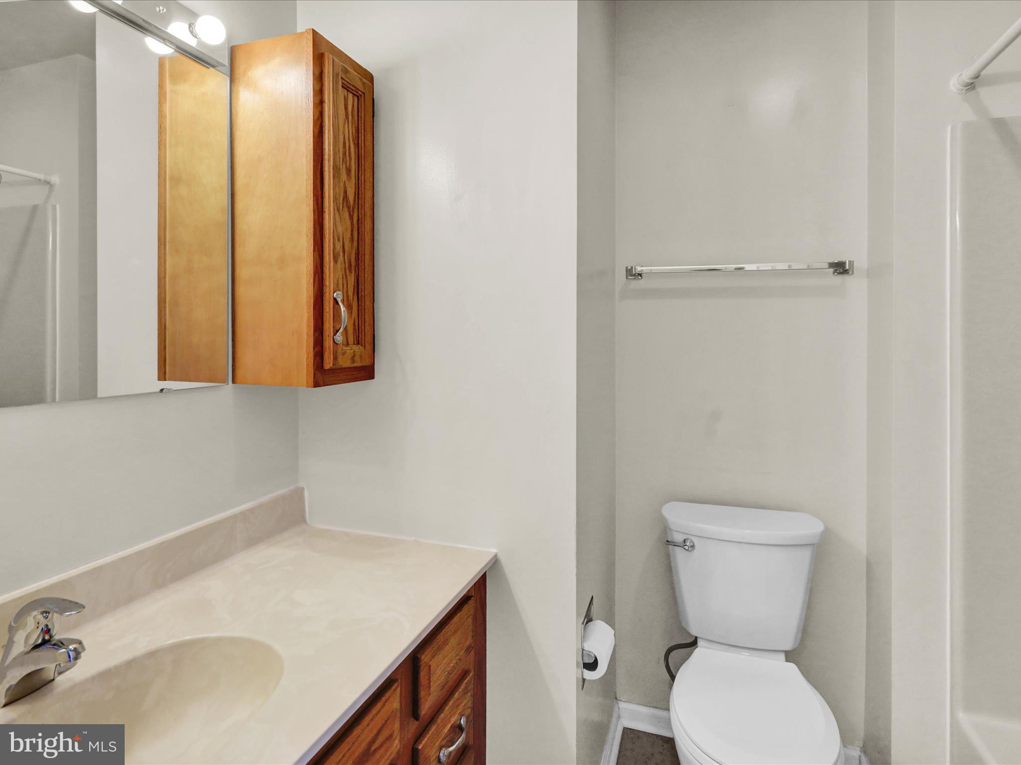 225 North 14th Street Reading, PA 19604 - Photo 18 of 23 a bathroom with a sink toilet and vanity