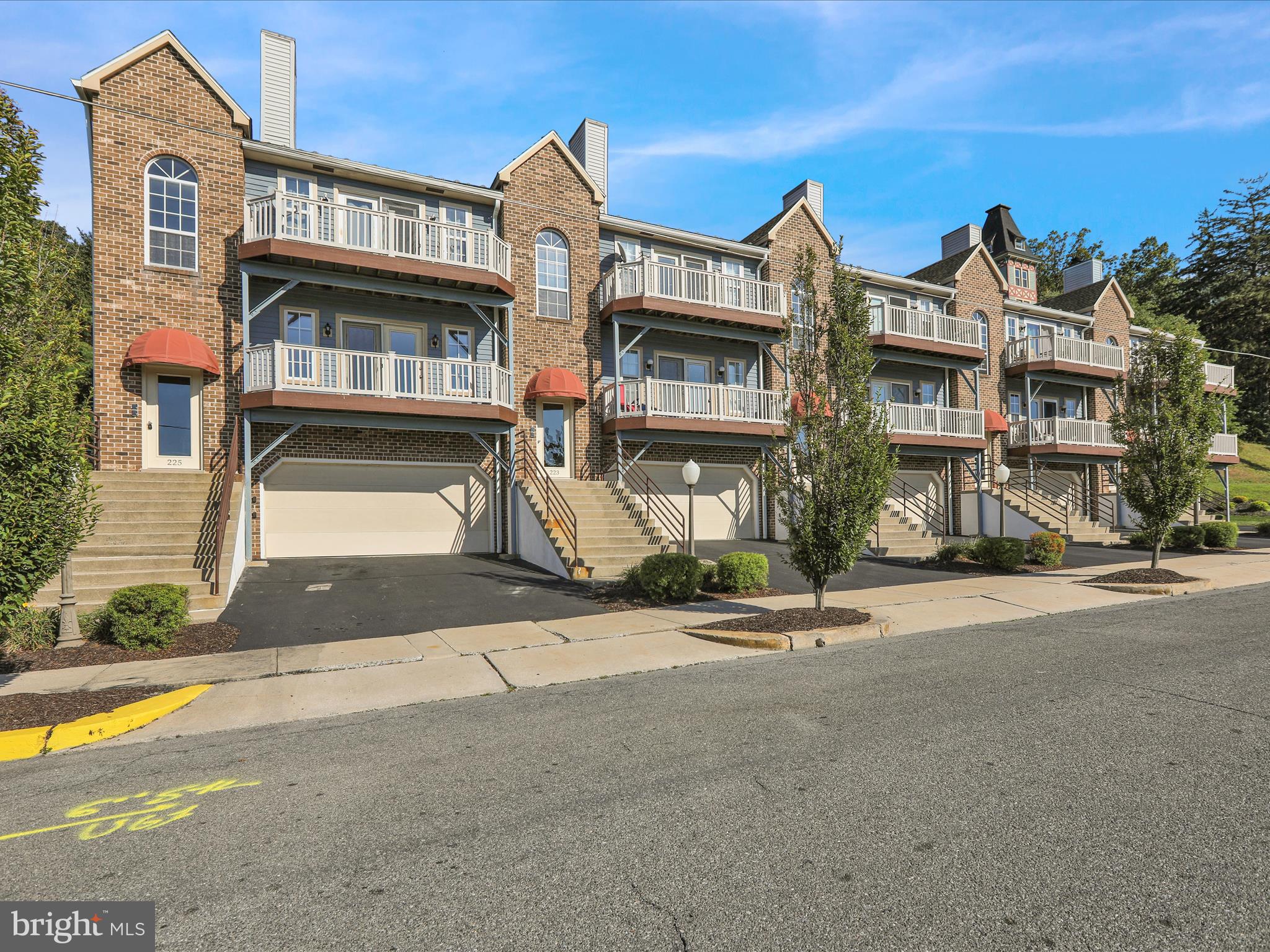 225 North 14th Street Reading, PA 19604 - Photo 22 of 23 a front view of a residential apartment building with a yard
