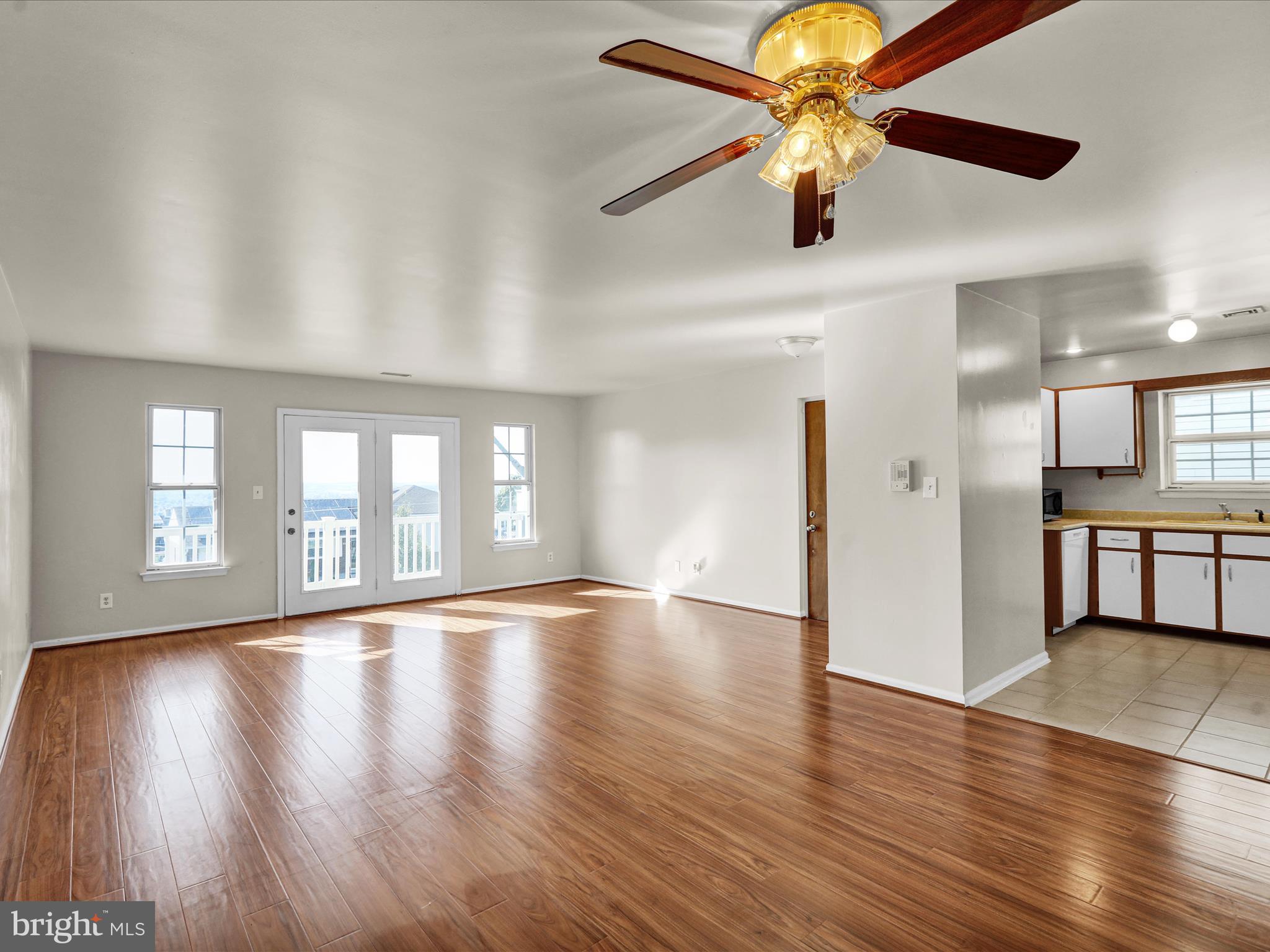 225 North 14th Street Reading, PA 19604 - Photo 6 of 23 a view of an empty room with window and wooden floor