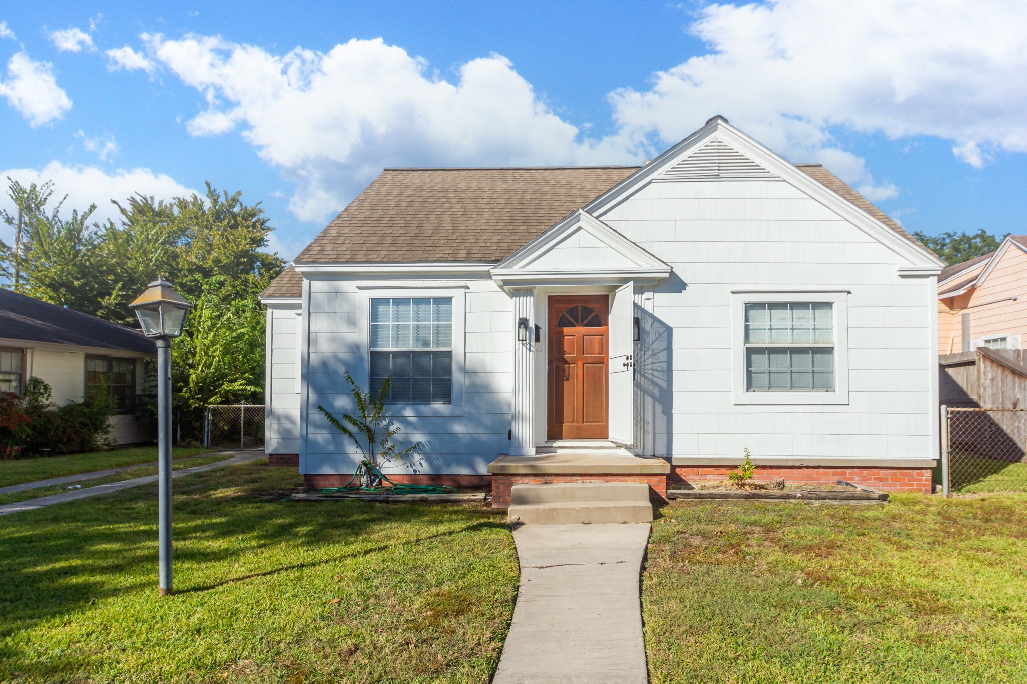 7447 Magnolia Street Houston, TX 77023 - Photo 1 of 38 a front view of house with yard