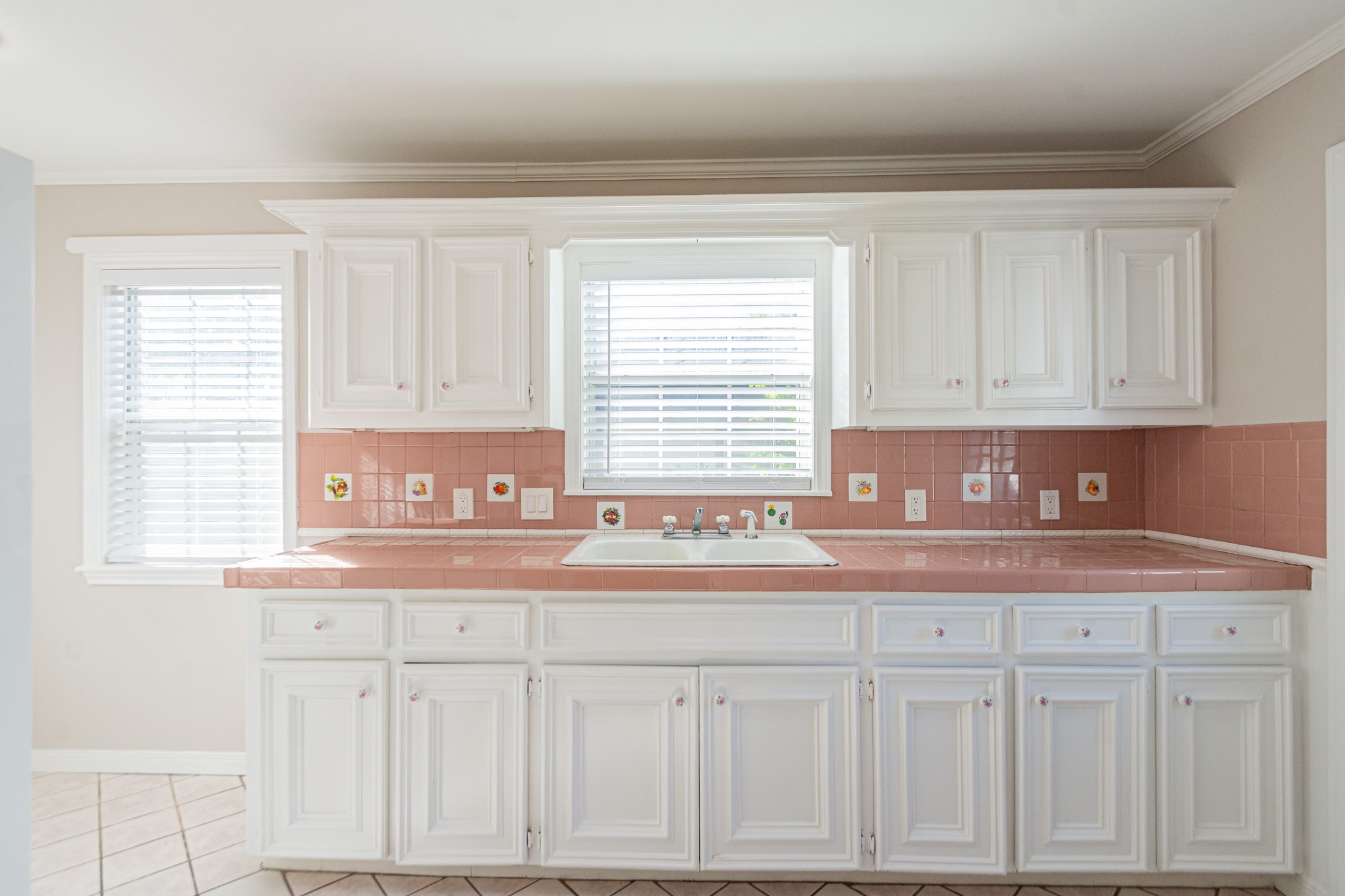 7447 Magnolia Street Houston, TX 77023 - Photo 11 of 38 a kitchen with granite countertop white cabinets and a sink