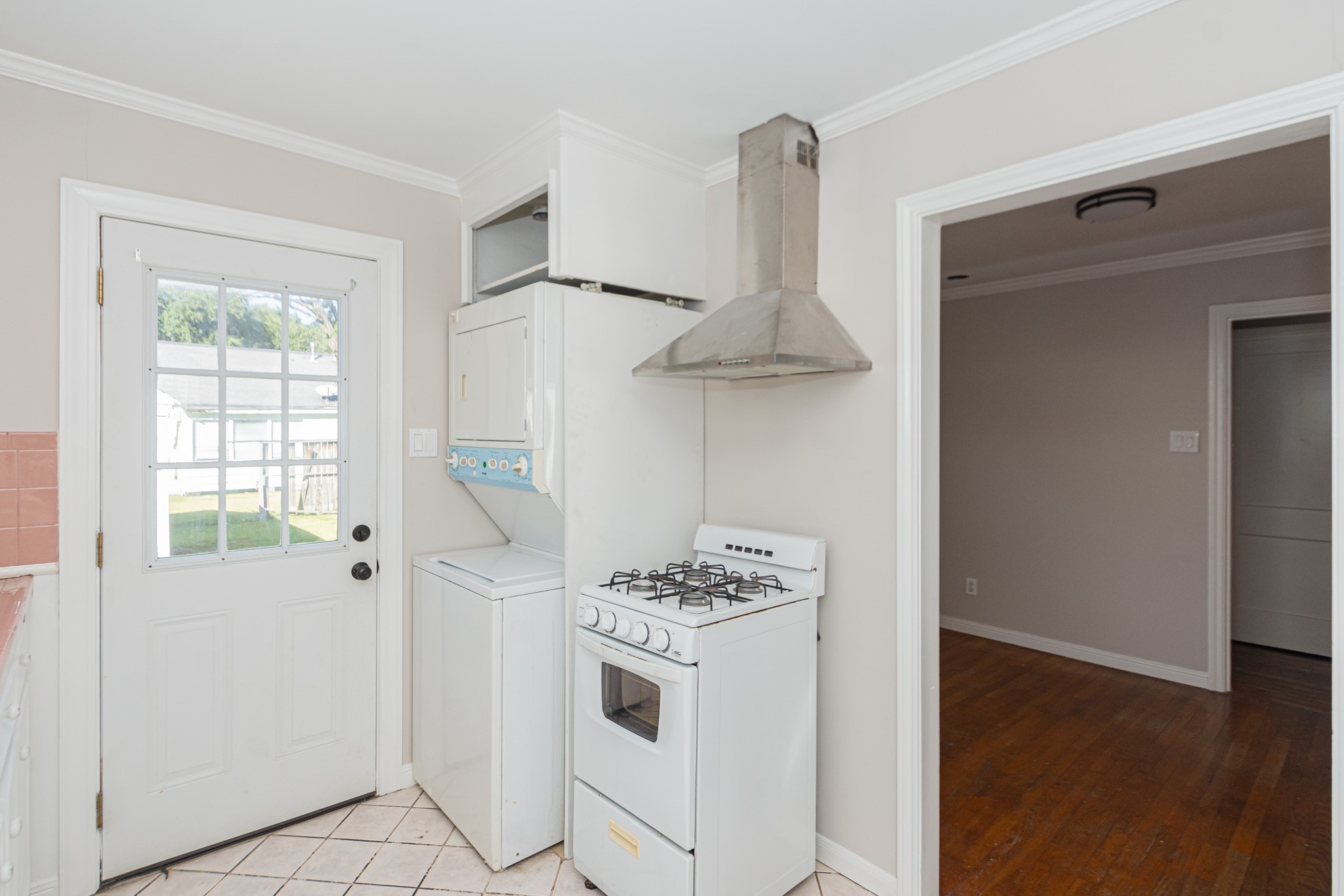 7447 Magnolia Street Houston, TX 77023 - Photo 16 of 38 a white kitchen with a stove top oven