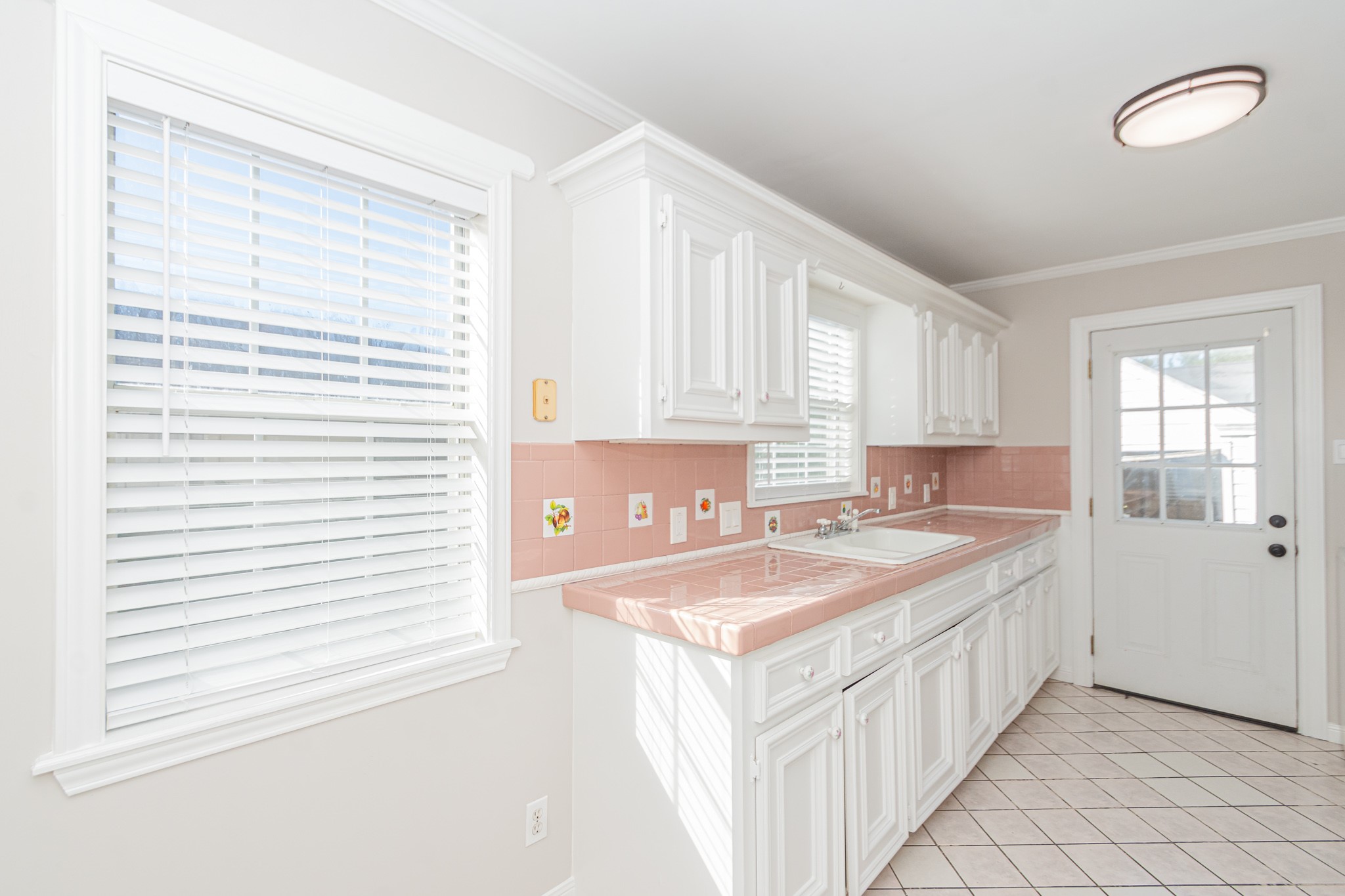 7447 Magnolia Street Houston, TX 77023 - Photo 17 of 38 a kitchen with a sink stove and cabinets