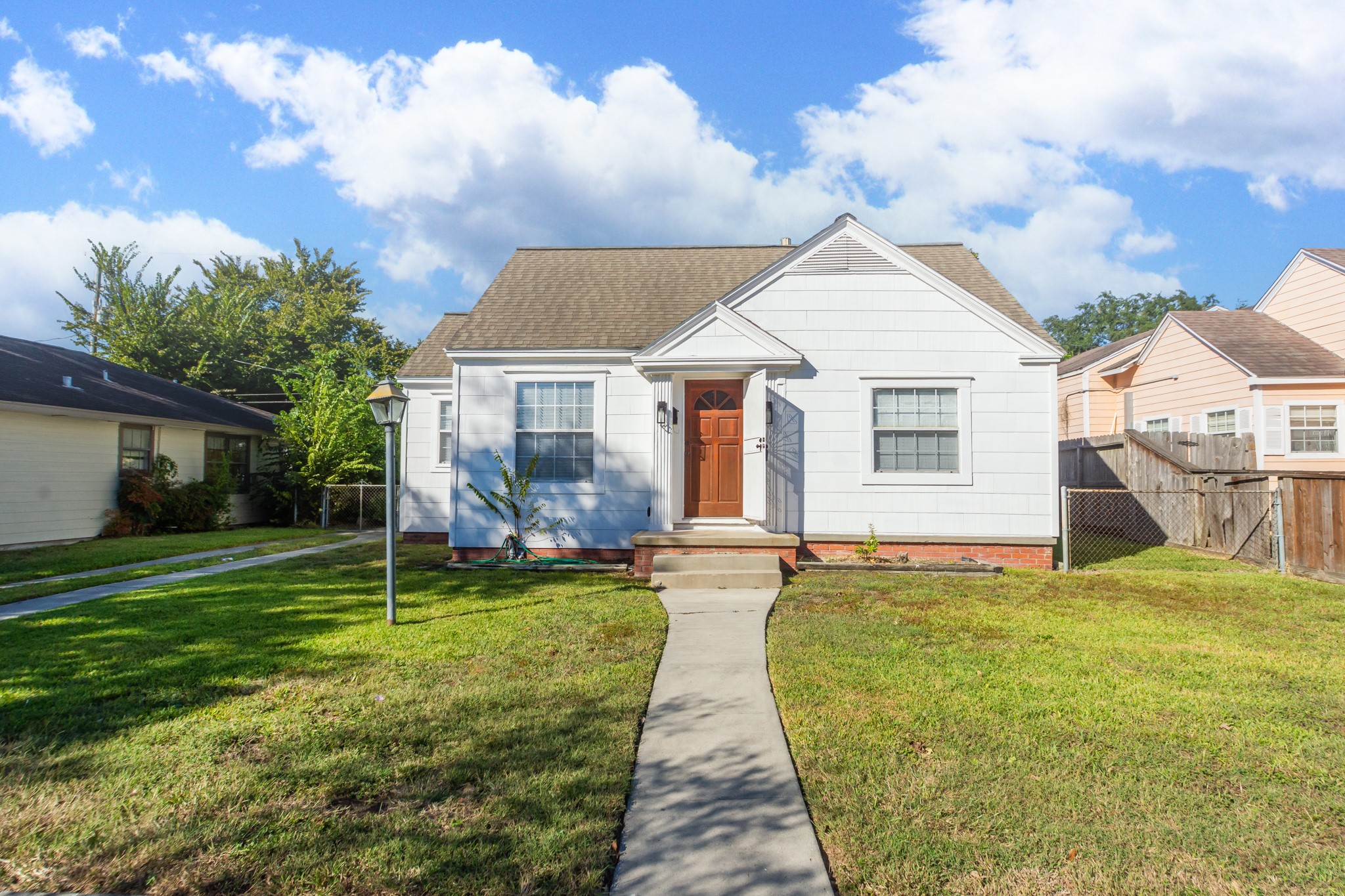 7447 Magnolia Street Houston, TX 77023 - Photo 2 of 38 a view of a house with a yard and sitting area