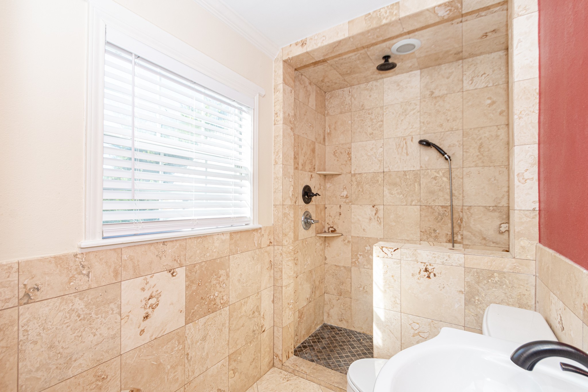 7447 Magnolia Street Houston, TX 77023 - Photo 24 of 38 a bathroom with a sink toilet and shower