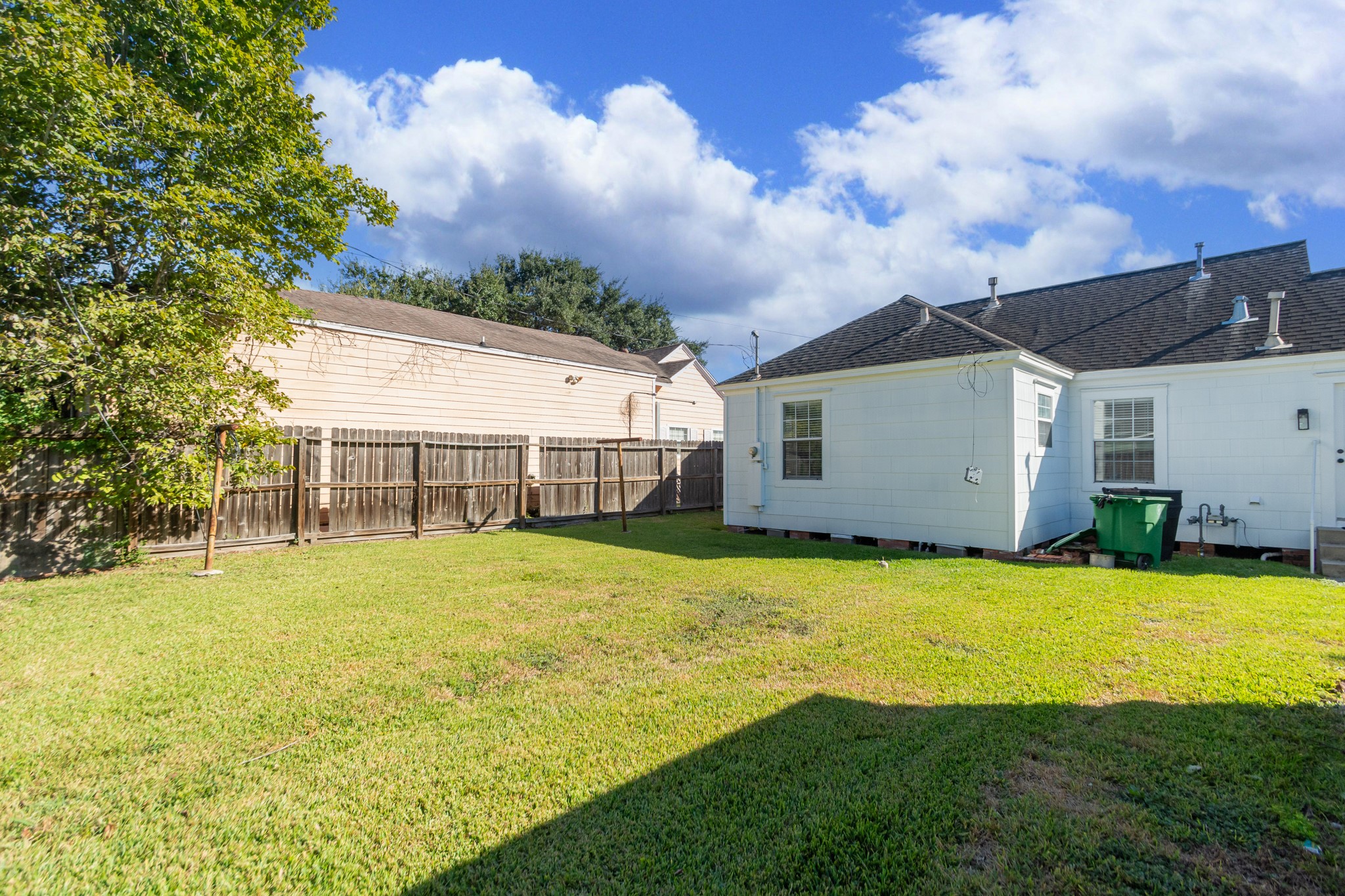 7447 Magnolia Street Houston, TX 77023 - Photo 37 of 38 a view of a house with a yard and basketball court
