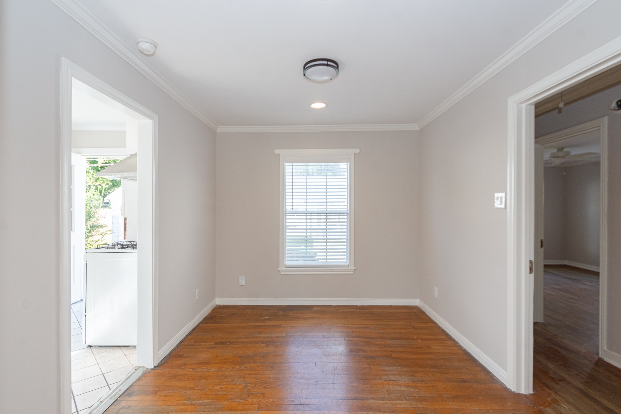 7447 Magnolia Street Houston, TX 77023 - Photo 8 of 38 wooden floor in an empty room with a window