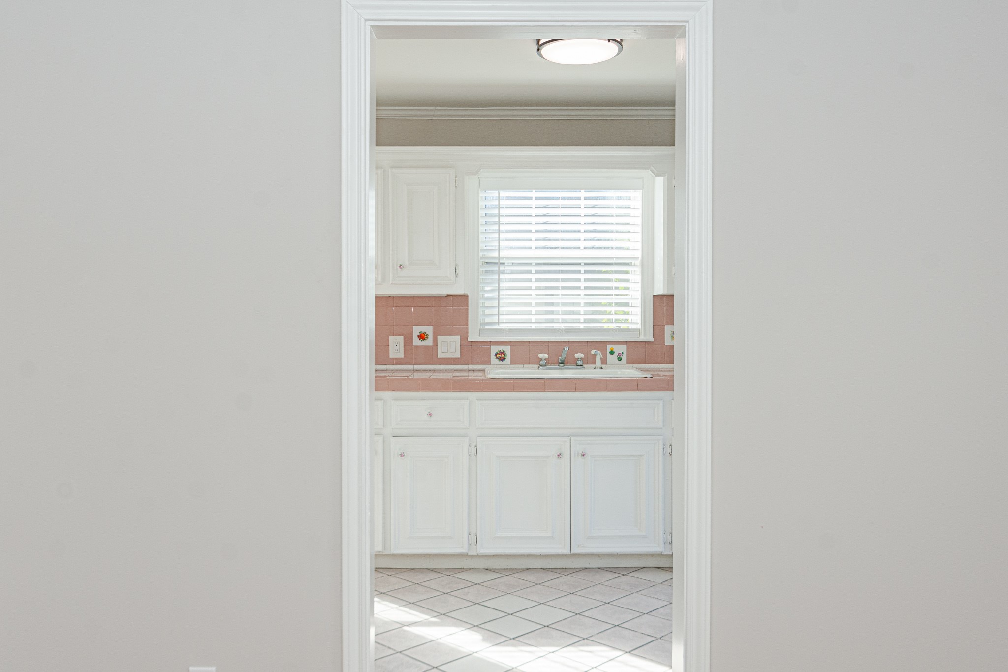 7447 Magnolia Street Houston, TX 77023 - Photo 10 of 38 a bathroom with a sink and a window