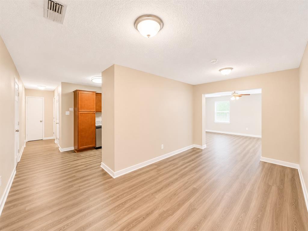 1231 Rutherford Drive Mesquite, TX 75149 - Photo 20 of 29 a view of a room with wooden floor and window