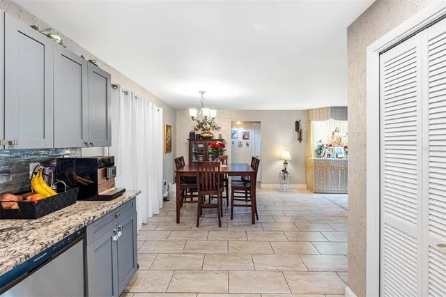 a kitchen with stainless steel appliances granite countertop a sink and cabinets