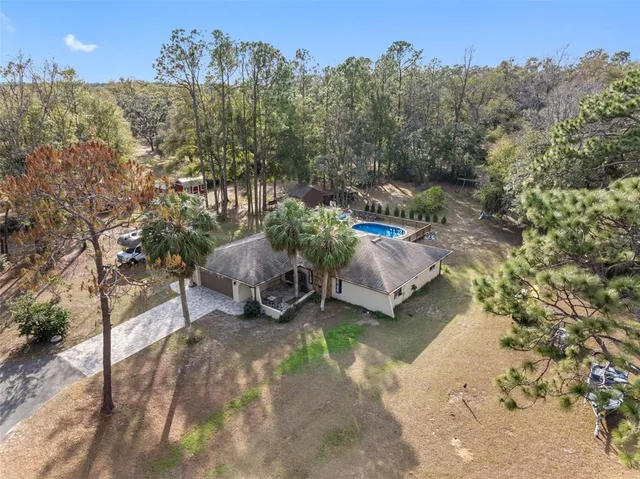 a view of a backyard with sitting area