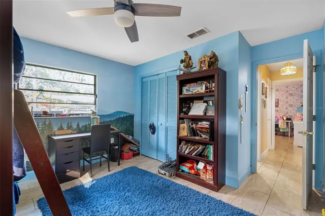a living room with furniture a piano and a window