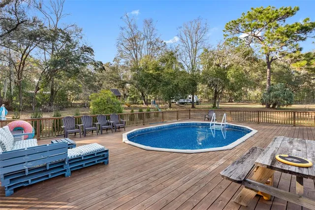 a view of a swimming pool with a patio