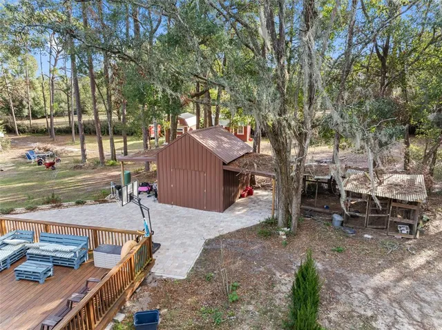 a view of a backyard with sitting area