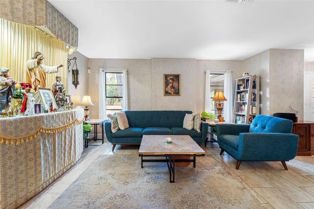 a living room with furniture and a rug