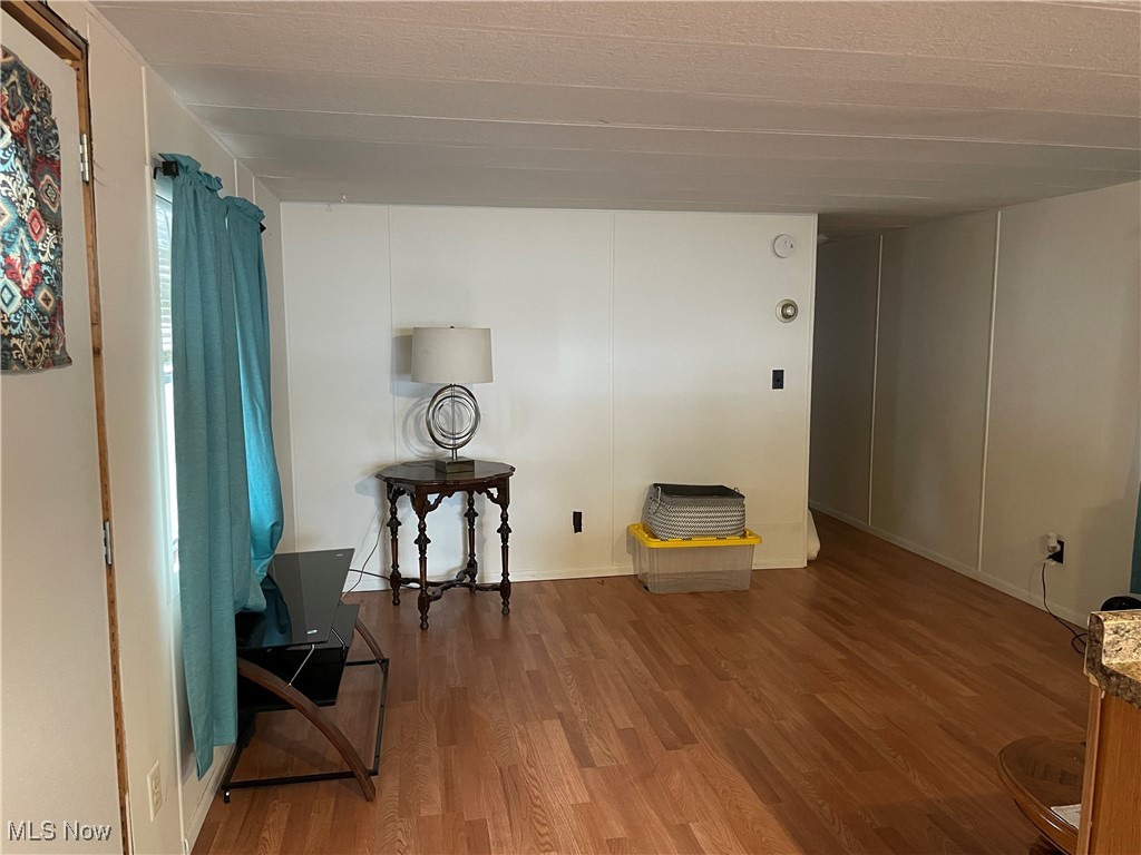 9329 Infirmary Road, Unit C13 Mantua, OH 44255 - Photo 4 of 9 Living area featuring wood finished floors