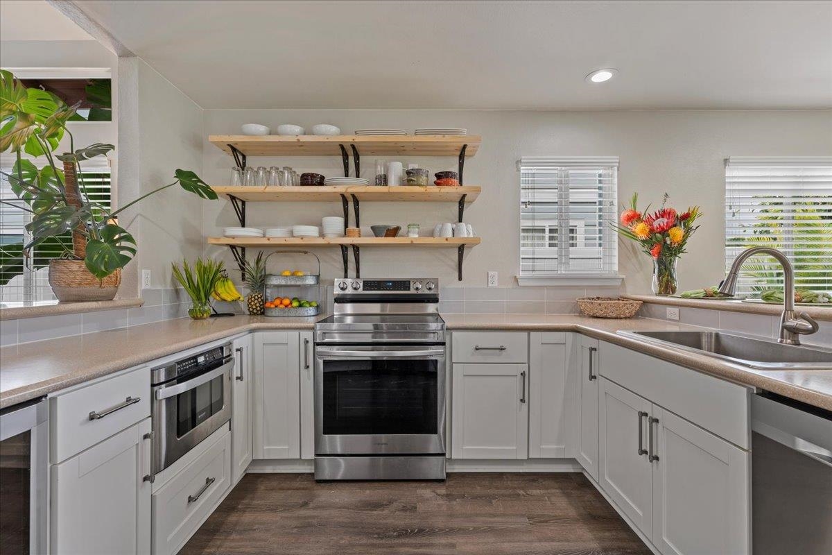 28 Papahi Loop Kahului, HI 96732 - Photo 12 of 50 a kitchen with stainless steel appliances granite countertop a sink and cabinets