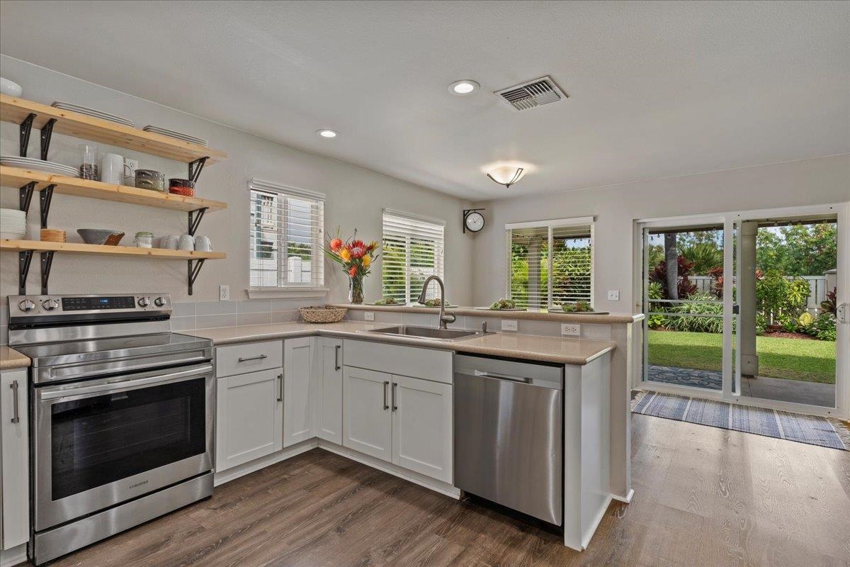 28 Papahi Loop Kahului, HI 96732 - Photo 14 of 50 a kitchen with granite countertop a stove and a sink