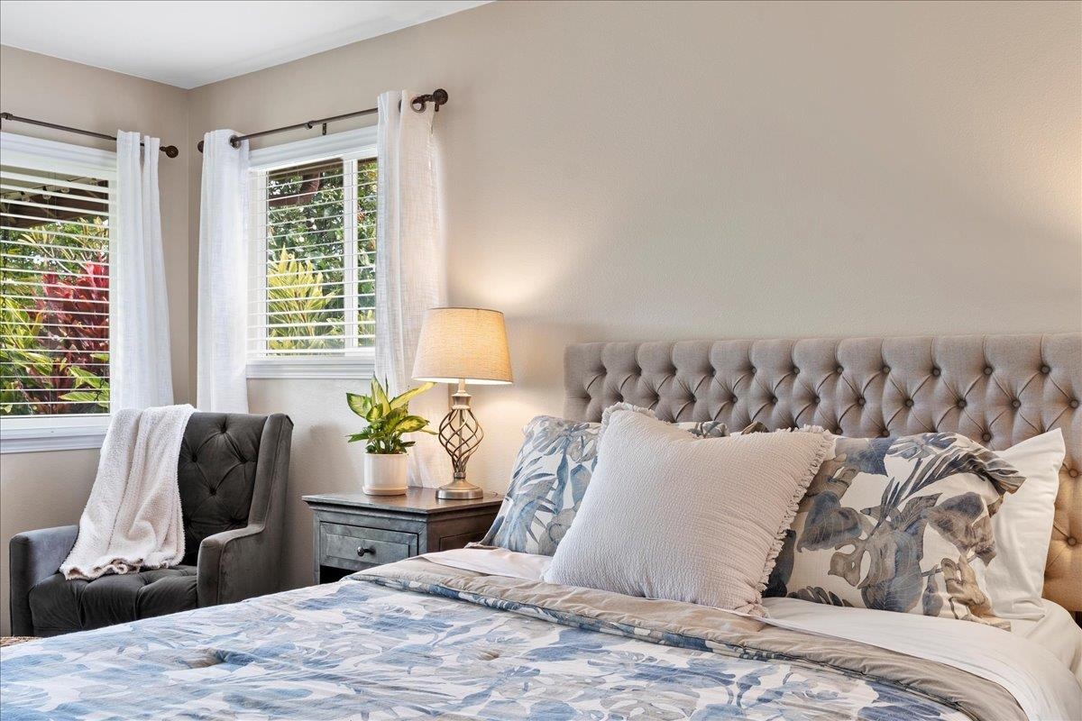 28 Papahi Loop Kahului, HI 96732 - Photo 32 of 50 a bedroom with a bed and wooden floor