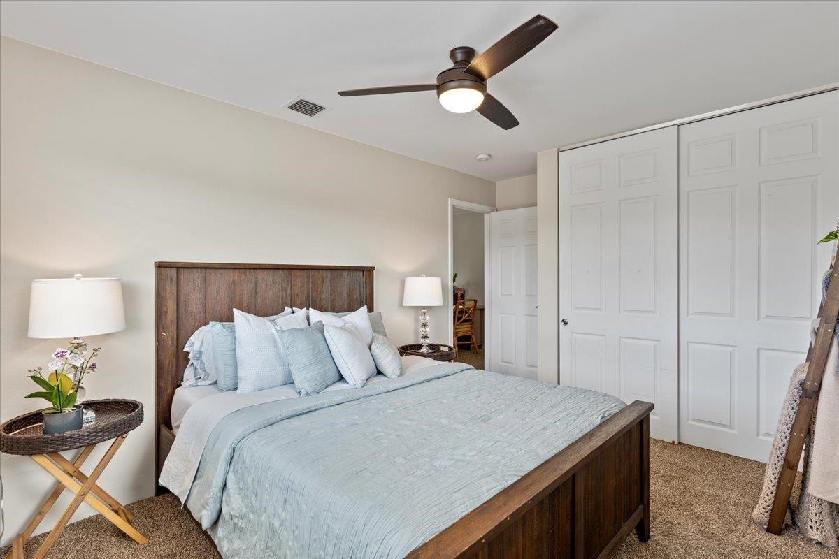 28 Papahi Loop Kahului, HI 96732 - Photo 39 of 50 a bedroom with a bed and painting on the wall