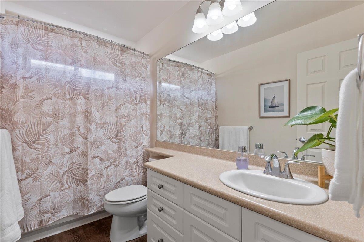 28 Papahi Loop Kahului, HI 96732 - Photo 41 of 50 a bathroom with a sink a toilet and a mirror
